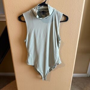 Sleek Sage Sleeveless Turtleneck Bodysuit